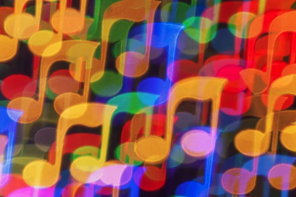 Renkli nota şeklinde bir arkaplan bokeh.