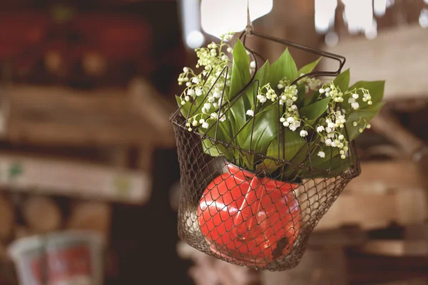 Bouquet of lily of the valley in the old red jug - vintage — Stock Photo, Image