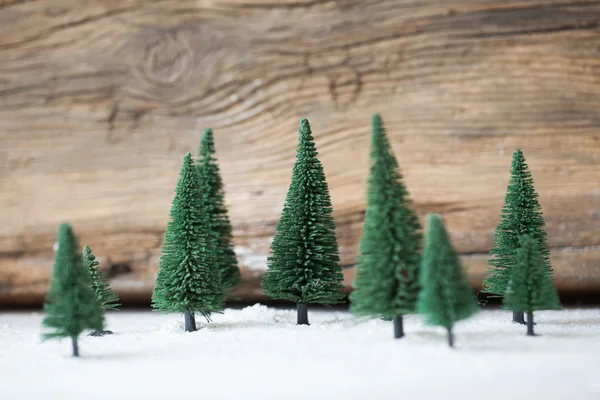 Julkort - en miniatyr julgran skog i snö - vinter — Stockfoto