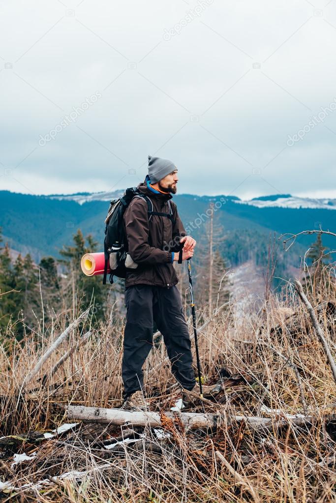 caucasian male hiking in mountains