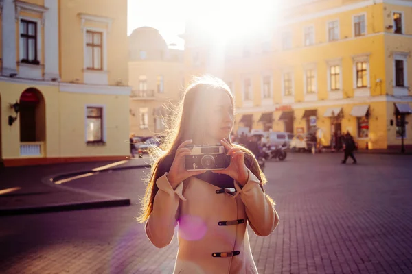 female with vintage camera