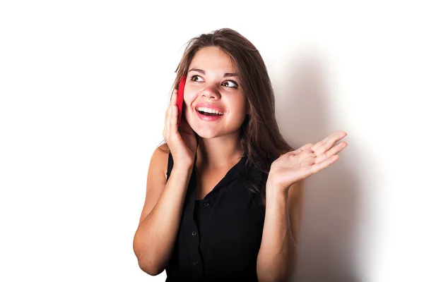 Young caucasian female speaking on phone isolated on white — Stock Photo, Image