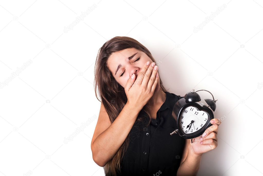 smiley businesswoman holding alarm clock. isolated on white back