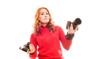 Woman holding vintage and modern cameras