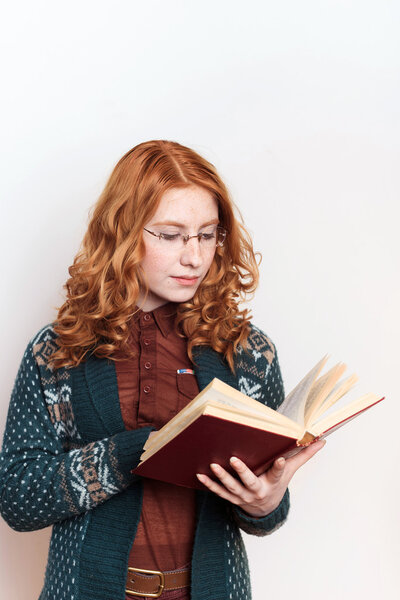 redhead student female with book