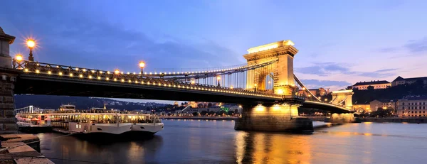 The Szechenyi Chain Bridge is a suspension bridge that spans the River Danube between Buda and Pest, the western and eastern sides of Budapest, the capital of Hungary. Royalty Free Stock Photos