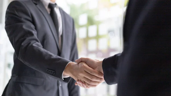Handshake, Both business people shake hands to celebrate financial success, Build friendship by holding hands, Congratulation and greetings concept.