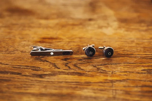 Close-up of a man in a tux fixing his cufflink — Stock Photo, Image