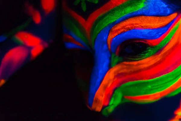 Woman with make up art of glowing UV fluorescent powder — Stock Photo, Image