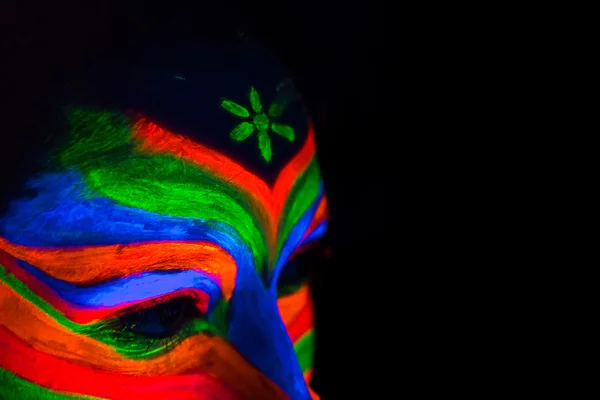 Woman with make up art of glowing UV fluorescent powder — Stock Photo, Image