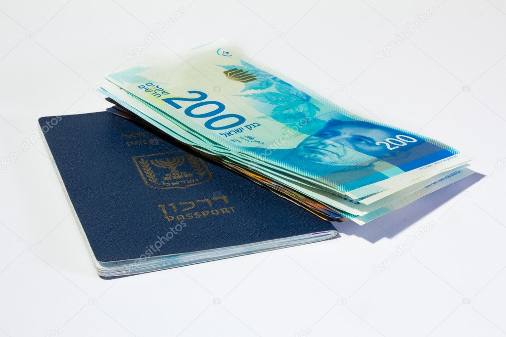 Stack of israeli money bills of 200 shekel and israeli passport