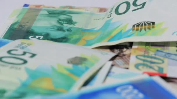 Pila di varie di Israele shekel banconote di denaro - Inclinazione — Video Stock