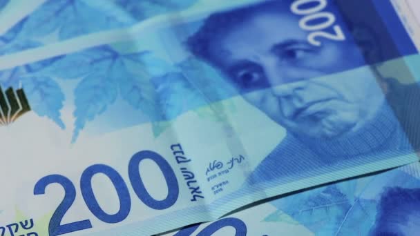 Banconote rotanti israeliane da 200 shekel - vista dall'alto — Video Stock