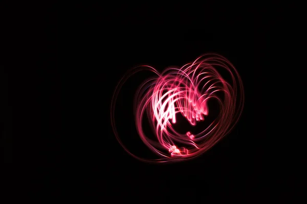Heart shaped glowing abstract curved lines