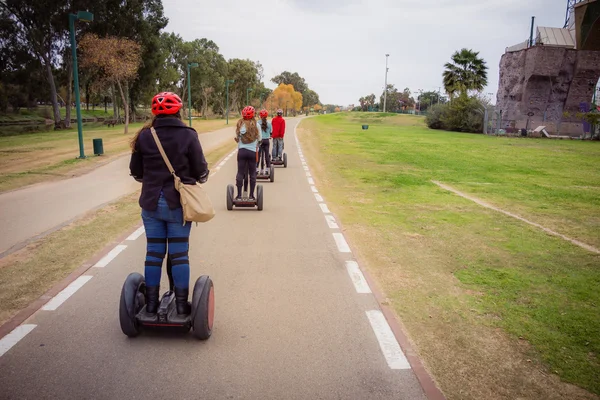Group of people traveling on Segway in the park — Stock Photo, Image