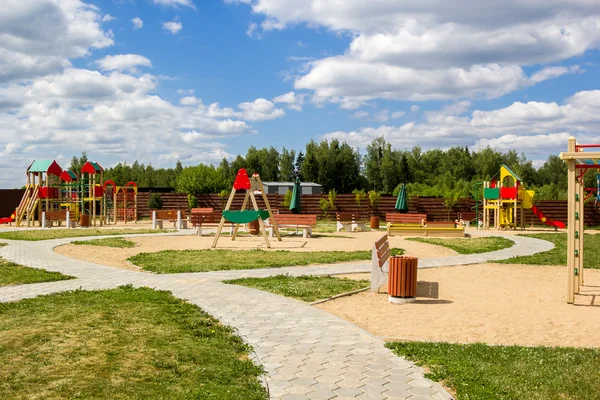 Children's playground with swings and slides countryside — Stock Photo, Image