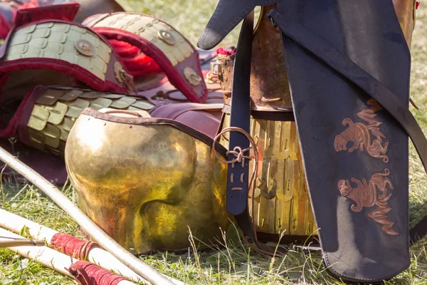 Ancient Roman armor of leather and metal lying on ground — Stock Photo, Image