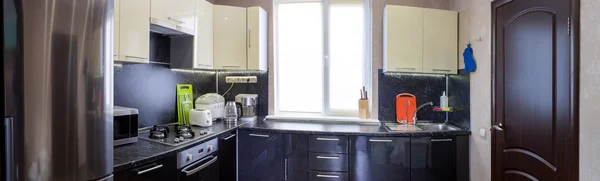 Panoramic view of kitchen with appliances and utensils — Stock Photo, Image