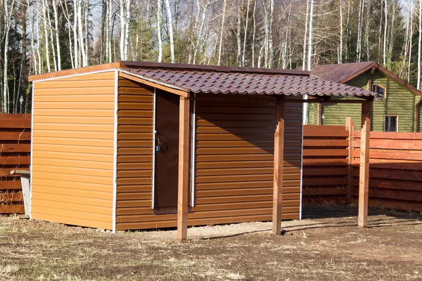 Small barn finished with siding — Stock Photo, Image