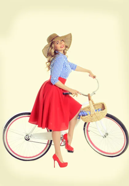 Girl with a bicycle in a retro style — Stock Photo, Image