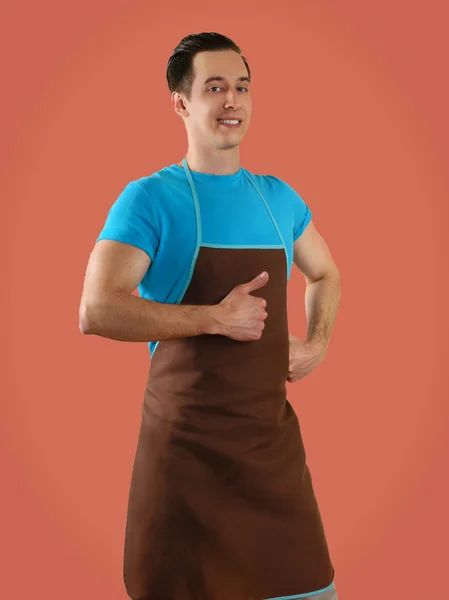 Man in apron isolated on background — Stock Fotó