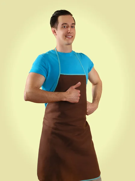 Man in apron isolated on background — Stok fotoğraf