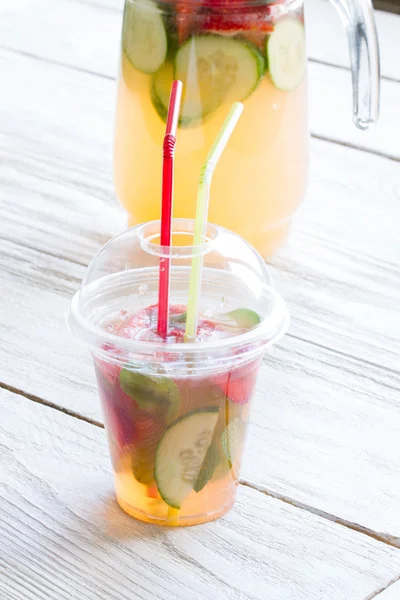 fresh lemonade with strawberries , kiwi and mint