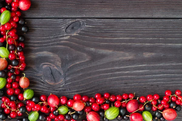 Frame of fresh berries on wooden background — Stock Photo, Image