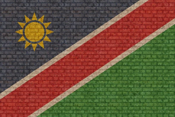 Flagga Namibia Gammal Tegelvägg Bakgrund — Stockfoto