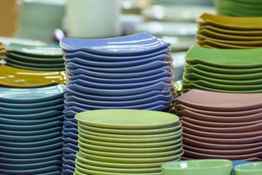 Stack of multicolored plates its was tile