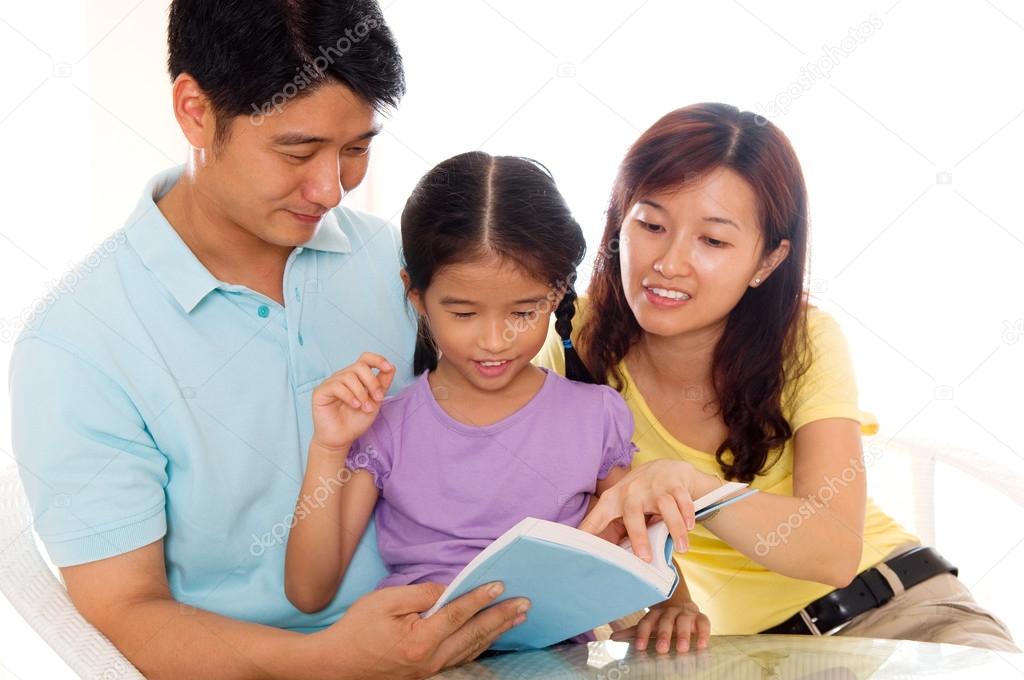 Asian family reading