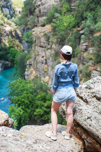 landscape in Manavgat Turkey. happy girl on the steep slope. valley and cliff. Koprulu national Park.