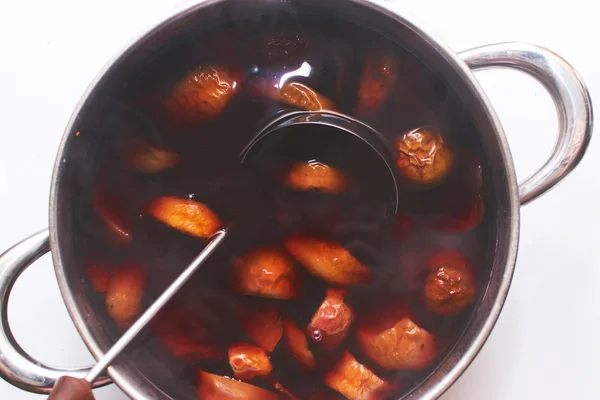 stewed fruit is cooked on the stove