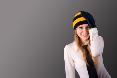 Pleasantly surprised young girl holding hand on head. Oh my God
