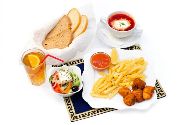 Complex lunch or dinner, food and drinks, french fries, meat, soup, salad, juice, bread — Stock Image Complex lunch or dinner, food and drinks, french fries, meat, soup, salad, juice, bread Stock Image