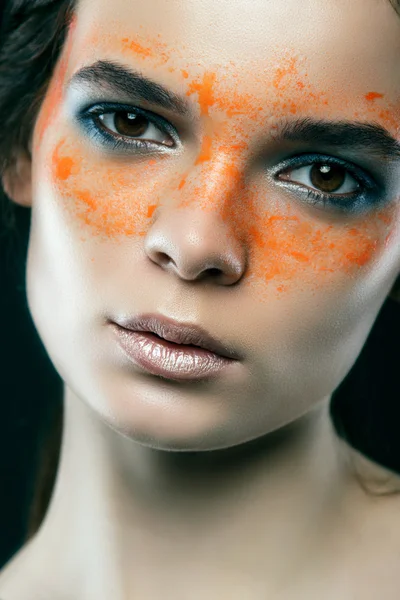 Beautiful girl with mud on his face. Cosmetic mask. Beauty face.