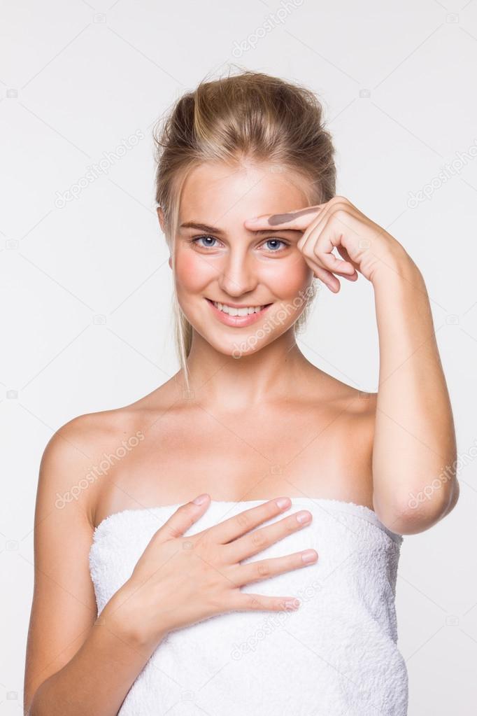 Young blond woman in a towel