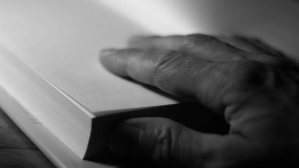 Man's hand  on pages — Stock Video