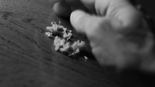 Hand gathering  crumbs of bread — Stock Video