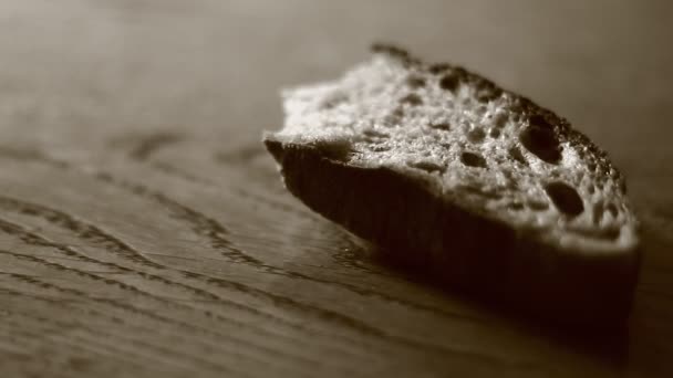 Piece of bread on table — Stock Video