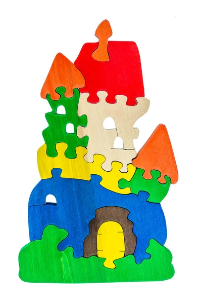 Colorful wooden puzzle pieces in castle shape — Stock Photo, Image