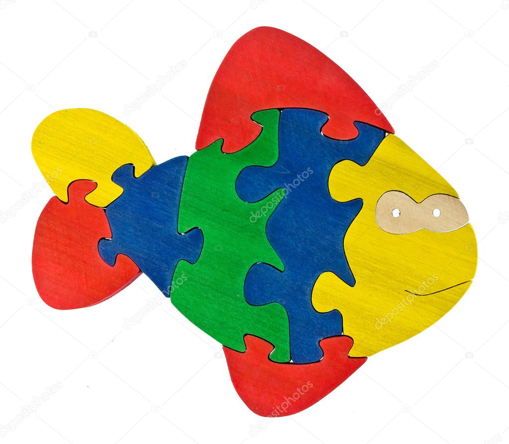 Colorful wooden puzzle pieces in fish shape