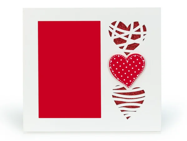 White photo frame with red hearts on isolaed  background — Stock Photo, Image