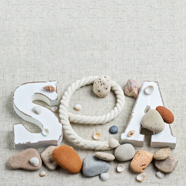 Concept of the summer time with sea shells and stones. Decorativ