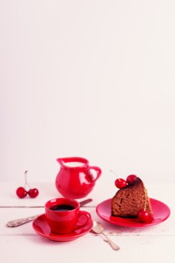 Chocolate cakes with cherries for breakfast and cup of coffee. S