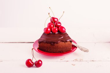 Chocolate cakes with cherries for breakfast and cup of coffee. S