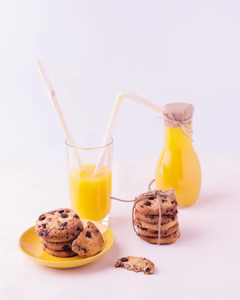 Homemade cookies with chocolate and orange juice. Isolated on a