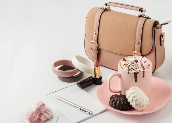 Hot chocolate with marshmallows and women's  fashion accessories