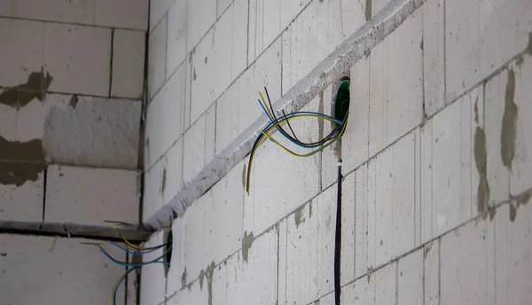 electrical wiring of the house, cable on the wall in the gate. Selective focus