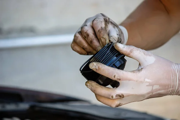replacing the oil filter on the car. Selective focus